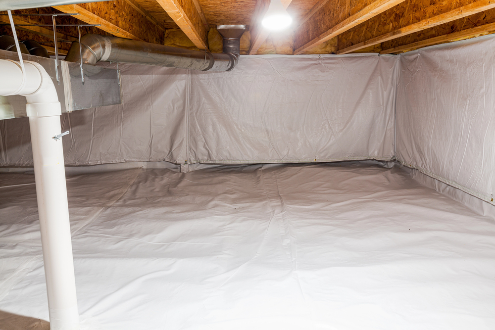 A clean, empty crawl space lined with white plastic vapor barrier on the floor and walls, exposed wooden ceiling beams, and visible pipes and ductwork.